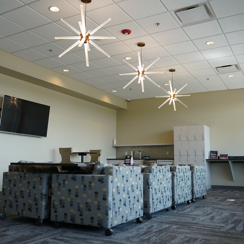 The CMURC Bay City entrance lobby, with a reception desk and patterned carpet.