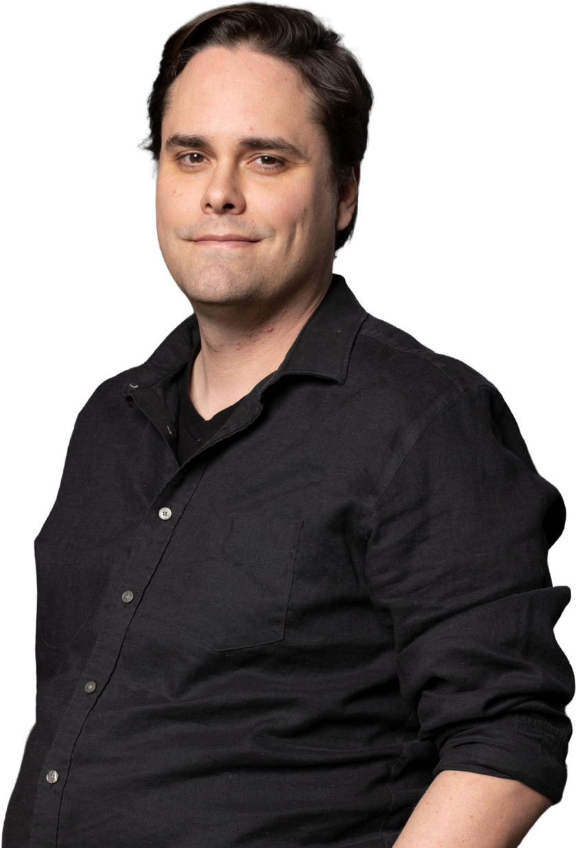 A man in a black button-down shirt standing inside the CMURC ring graphic.